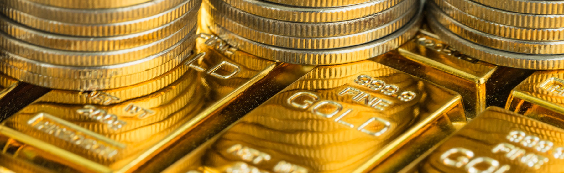 Goldbarren und Goldmünzen